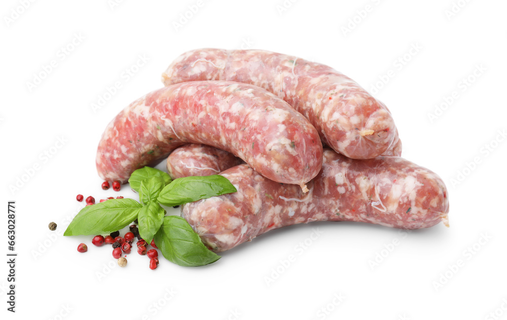 Raw homemade sausages, basil and spices isolated on white Raw homemade sausages, basil and spices isolated on white