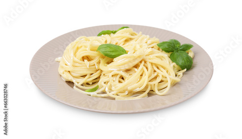 Delicious pasta with brie cheese and basil leaves on white background