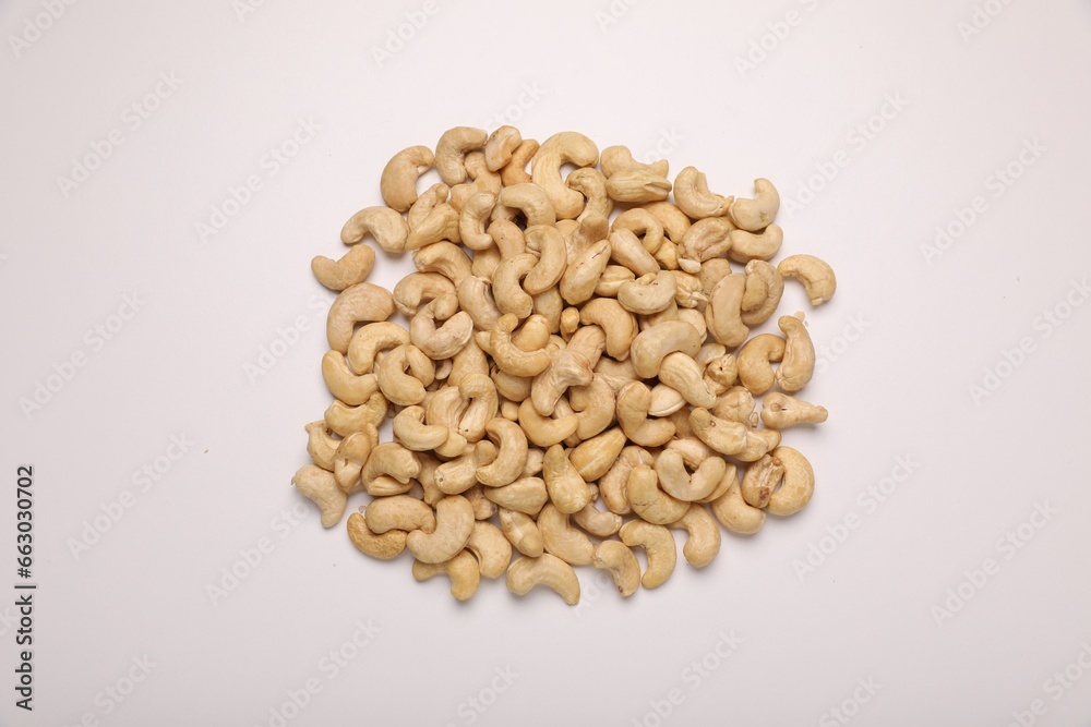 Pile of tasty cashew nuts on white background, top view Pile of tasty cashew nuts on white background, top view