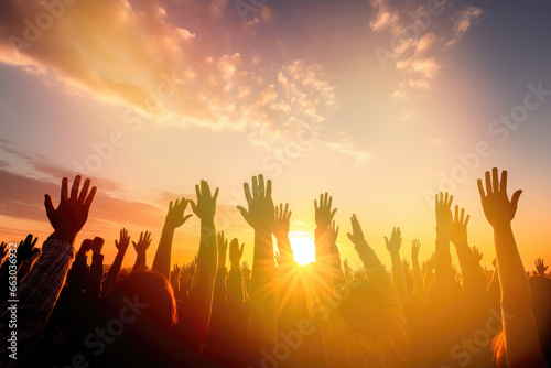 Print op canvas Hands to heaven, group of people with their hands up looking at the sunset