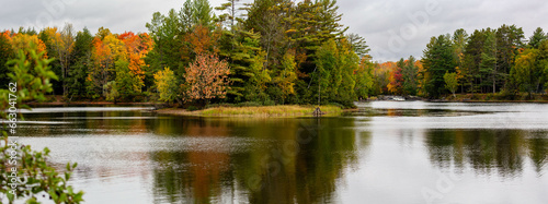 Waterfalls flowing into Lake of the Falls in Mercer, Wisconsin in September
