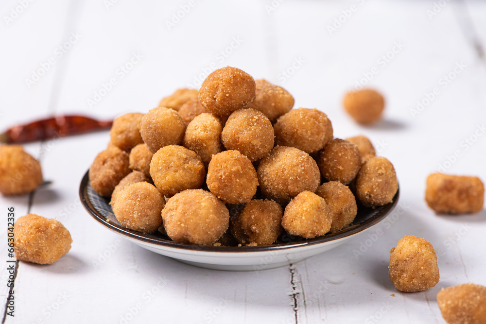 flavored peanuts or crunchy Peanut in a plate on table. flavored peanuts or crunchy Peanut in a plate on table.