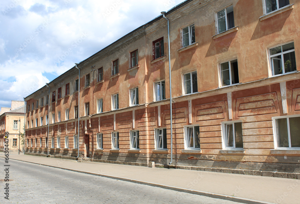 Abandoned three-story building with no people and no cars in Daugavpils, Latvia