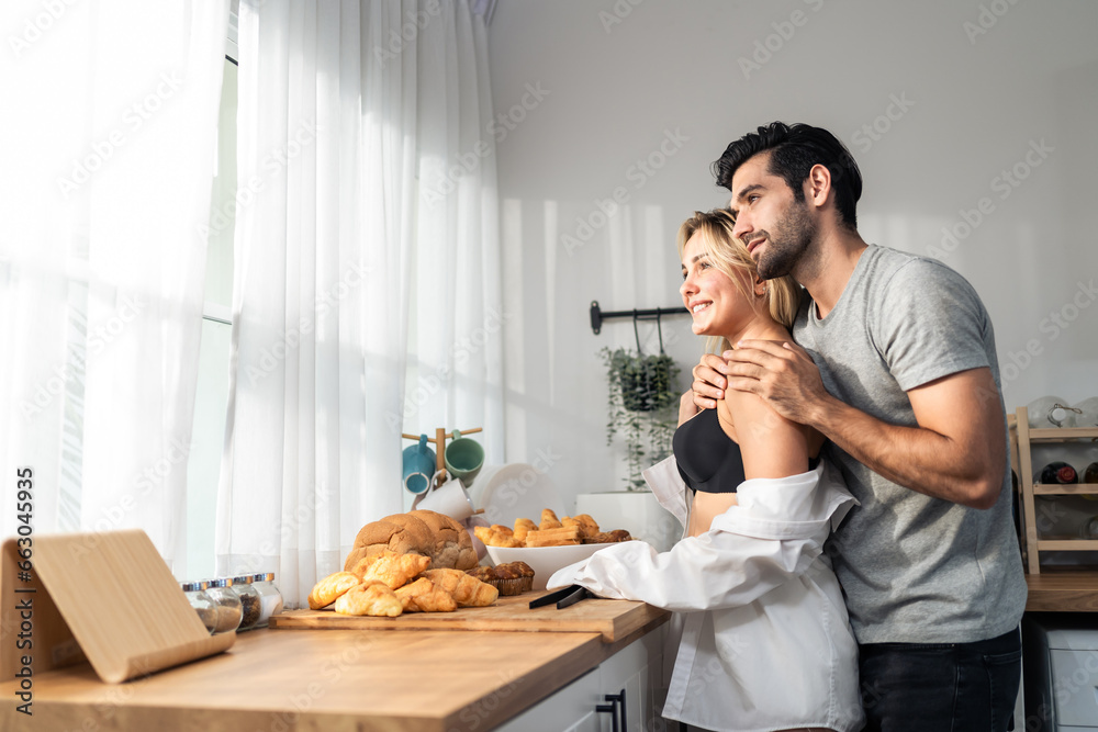 Caucasian young hot sexy couple baking bakery foods in kitchen at home. 