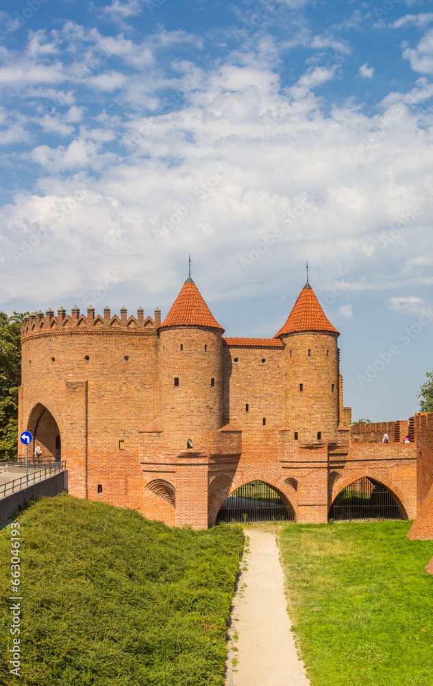 Historic red brick city gate in the center of Warsaw, Poland