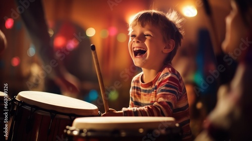 A spirited child in a percussion class, laughing with joy as he strikes the drum with mallets.