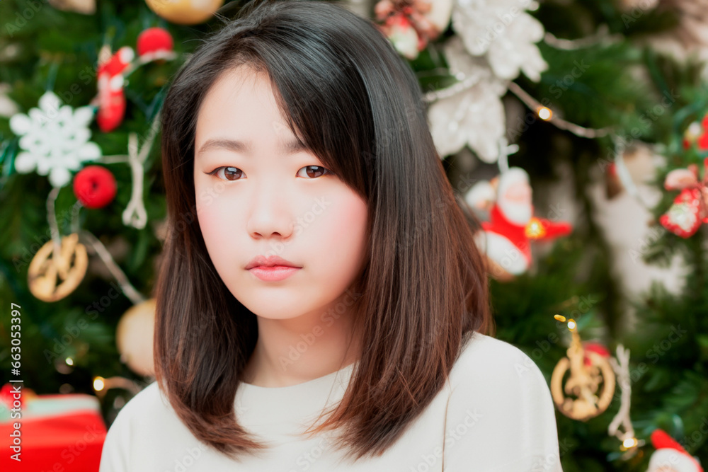 Christmas portrait of a Japanese woman in a white sweatshirt