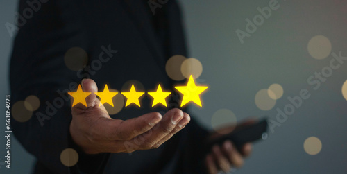 Fototapeta Naklejka Na Ścianę i Meble -  Business people touching on virtual screen on five star, customer service and satisfaction concept. Experience and feedback of customers. Rating very impressed.
