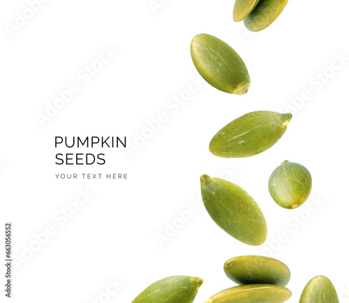 Creative layout made of pumpkin seeds on the white background. Flat lay. Food concept. Macro concept. 