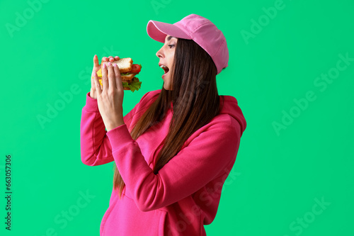 Young woman eating tasty sa...