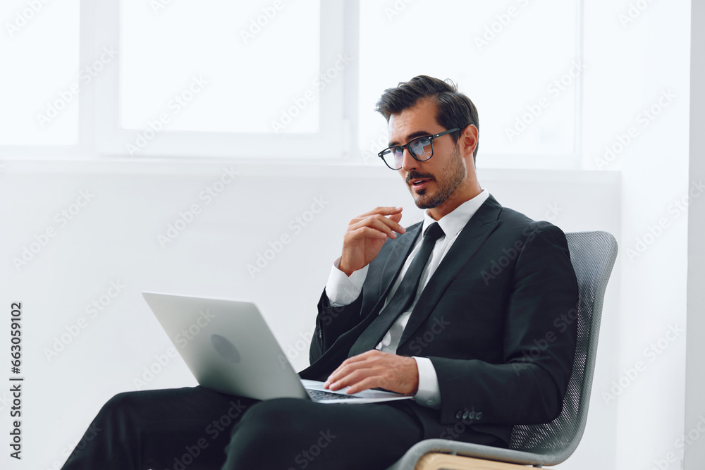 Computer man laptop business office professional businessman technology job success happy chair winner