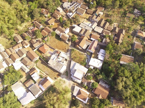 Bird's eye view of a developed residential area with cityscape and trees, Bojong Koneng - Bandung, Indonesia. Drone Photography, Aerial Photography, Landscape. photo