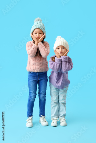 Cute little girls in warm c...