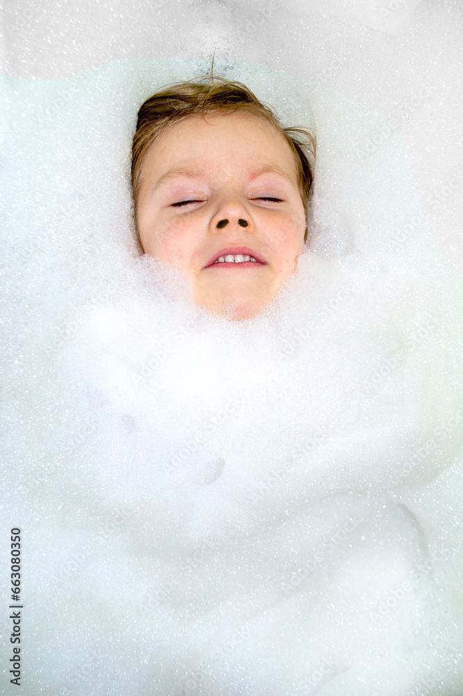 Happy little baby boy face swimming in the bathroom Happy little baby boy face swimming in the bathroom