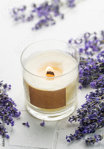 Aroma Candle. Lavender candle on a white tile background.