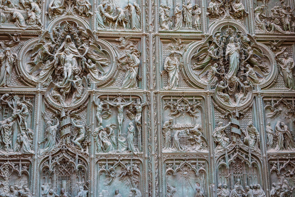 Detail of a bronze door of Milan cathedral, Italy