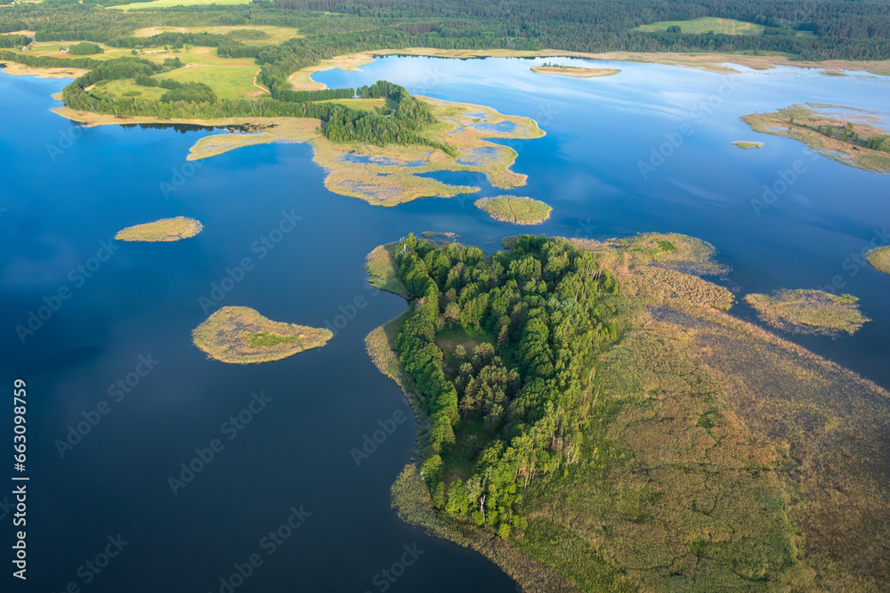 Fototapeta premium Aerial view of National park Braslav Lakes in sunny day. Panaramic view on beautiful blue lakes in autumn. Travel to Vitepbsk region.