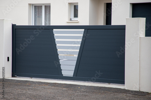 portal grey dark modern home steel slide door gray aluminum gate slats © OceanProd
