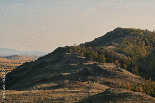 Autumn mountain landscape, view of mountain peaks, mountain valley, mountain roads and trails 