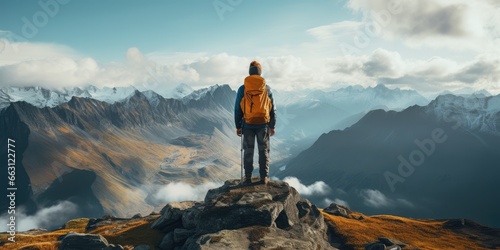 a image Man traveler on mountain summit enjoying nature, Generative AI photo