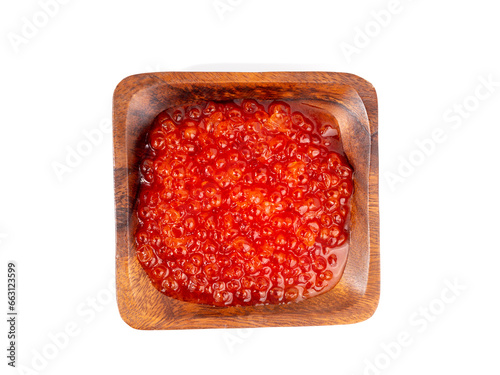 Wooden cup with red caviar on a white background. Red caviar close-up.