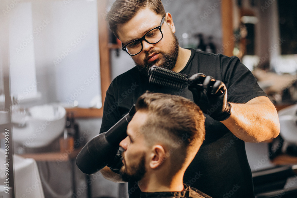 Handsome man at a barber shop styling hair Handsome man at a barber shop styling hair