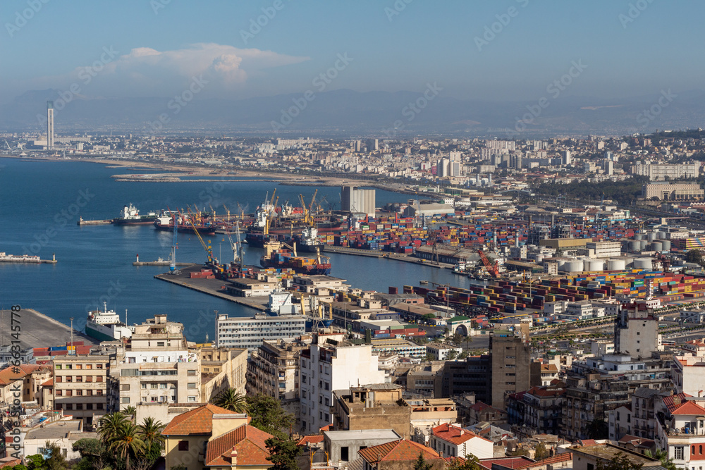 Algiers, Alger, Algeria : Beautiful panorama of the bay of Algiers, with the industrial port and the Djamaa El-Djazaïr (English : Great Mosque) in the background. Algiers, Alger, Algeria : Beautiful panorama of the bay of Algiers, with the industrial port and the Djamaa El-Djazaïr (English : Great Mosque) in the background.