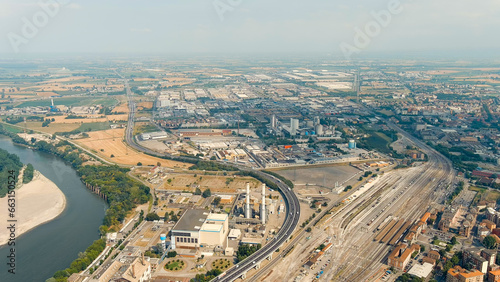 Piacenza, Italy. Industrial area with highway and railway station. Po River. Summer day, Aerial View