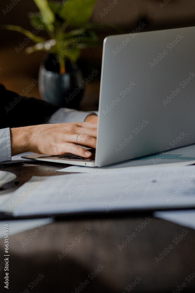 Close up shot of human hands typing some text on laptop. Business person using pc to search information in Internet. Data analytic working via computer to check web sources Close up shot of human hands typing some text on laptop. Business person using pc to search information in Internet. Data analytic working via computer to check web sources