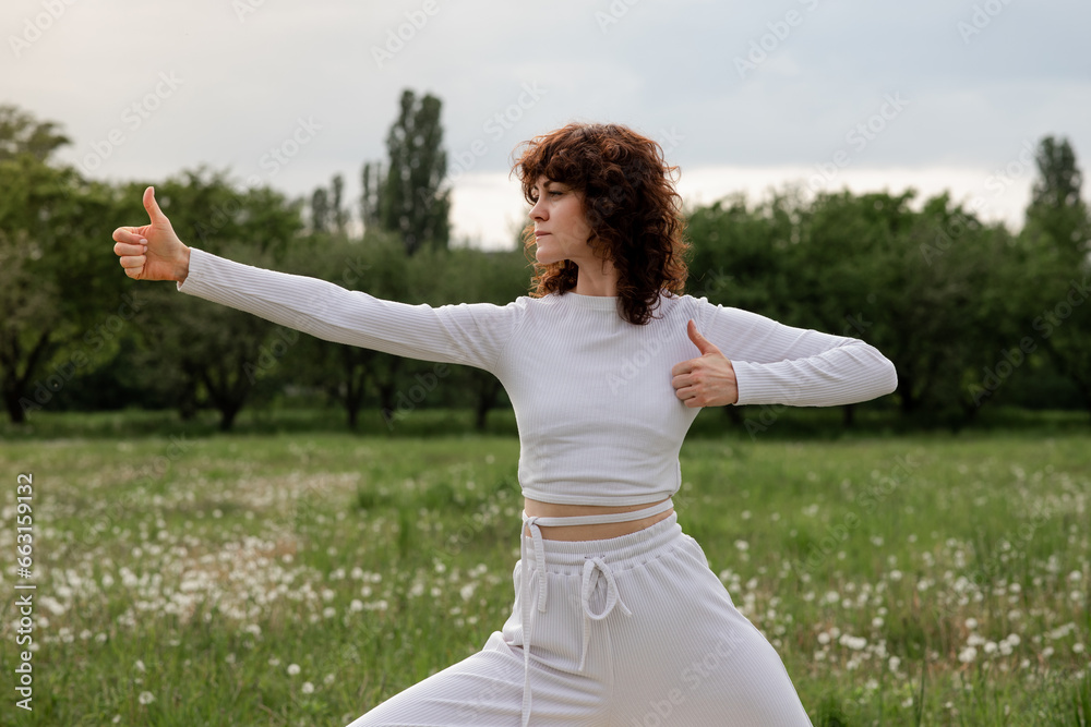 Concept finger yoga technique. Young girl using her movements of the hands utilize sensory receptors. Sports woman save her calmness thank to meditation practicing every day Concept finger yoga technique. Young girl using her movements of the hands utilize sensory receptors. Sports woman save her calmness thank to meditation practicing every day