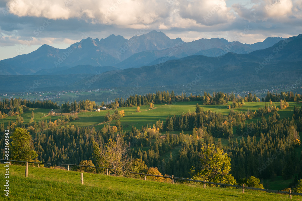 Obraz premium Views of rural farm fields and the Tatra Mountains from Suche, a village near Zakopane, Poland
