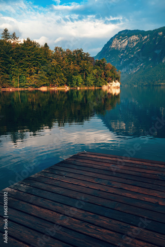 Fototapeta Naklejka Na Ścianę i Meble -  Wooden wharf pier at lake Bohinj in summer morning