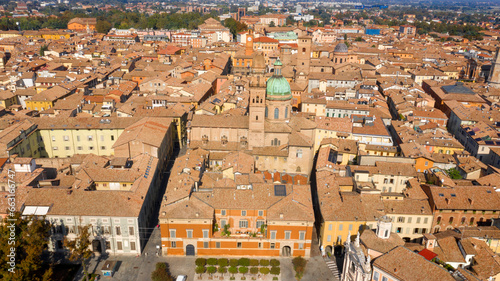 Aerial view of the historic center of Reggio Emilia, Italy. You can see the churches of the city and the typical roofs of medieval Italian architecture.