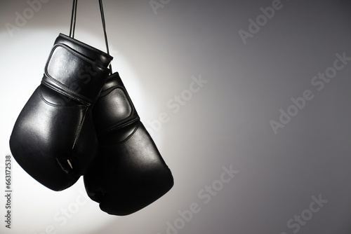 Black boxing gloves on a white background © Atlas
