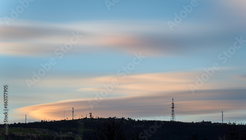 Long Exposure of Communication Antennas Silhouette On Mountain During Dusk © F.C.G.