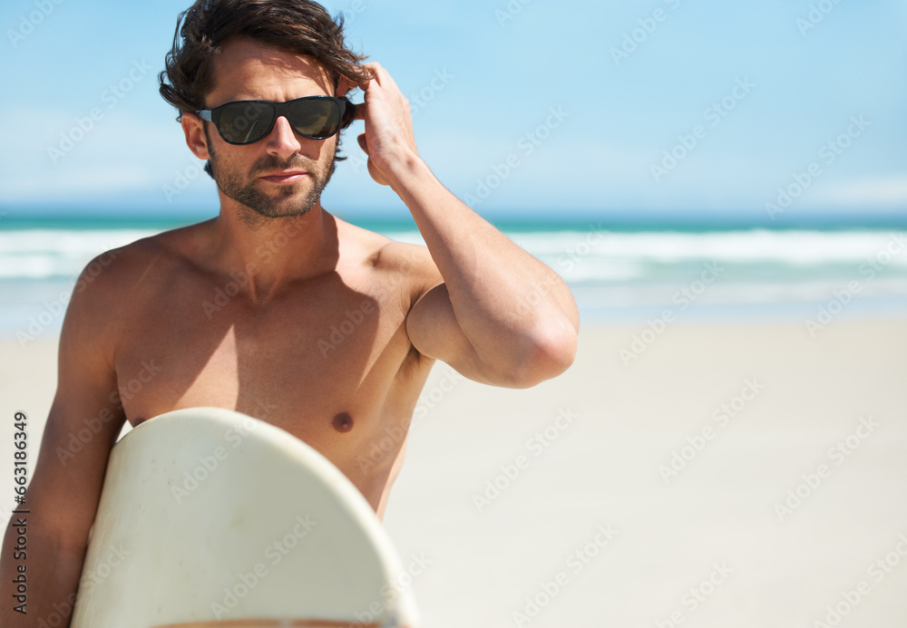Man, surf and vacation with sunglasses by the beach and sea for fitness and water sport with mockup space. Confidence, male person and surfboard for workout and training by the ocean with freedom Man, surf and vacation with sunglasses by the beach and sea for fitness and water sport with mockup space. Confidence, male person and surfboard for workout and training by the ocean with freedom