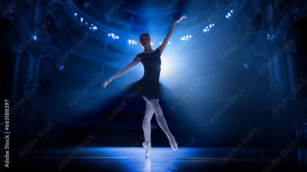 Training before performance. Young woman, elegant ballet dancer in motion, dancing on theater stage with spotlights. Concept of classical dance, art and grace, beauty, choreography, inspiration
