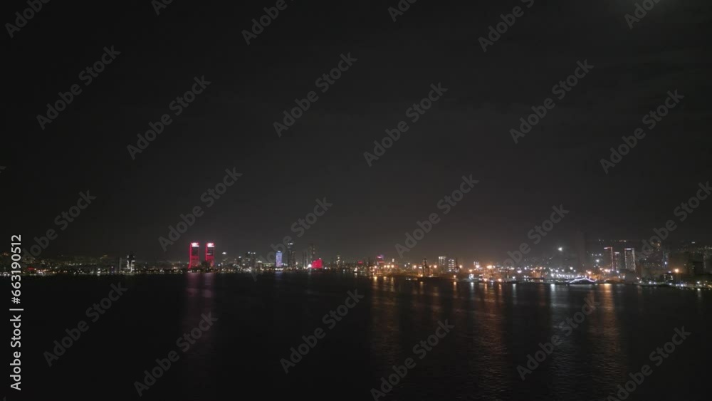 Aerial night shot over the sea with the ferryboats and city views in Izmir Turkey. High quality 4k footage Aerial night shot over the sea with the ferryboats and city views in Izmir Turkey. High quality 4k footage