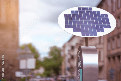 Solar Panel for Charging e Bike on City Street. Public Charging Station Solar Battery for Electric Bicycles Share System.  photo