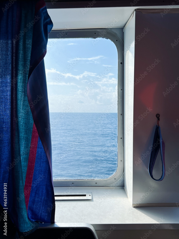 Fototapeta premium View of the sea and sky from the window of moving ferry