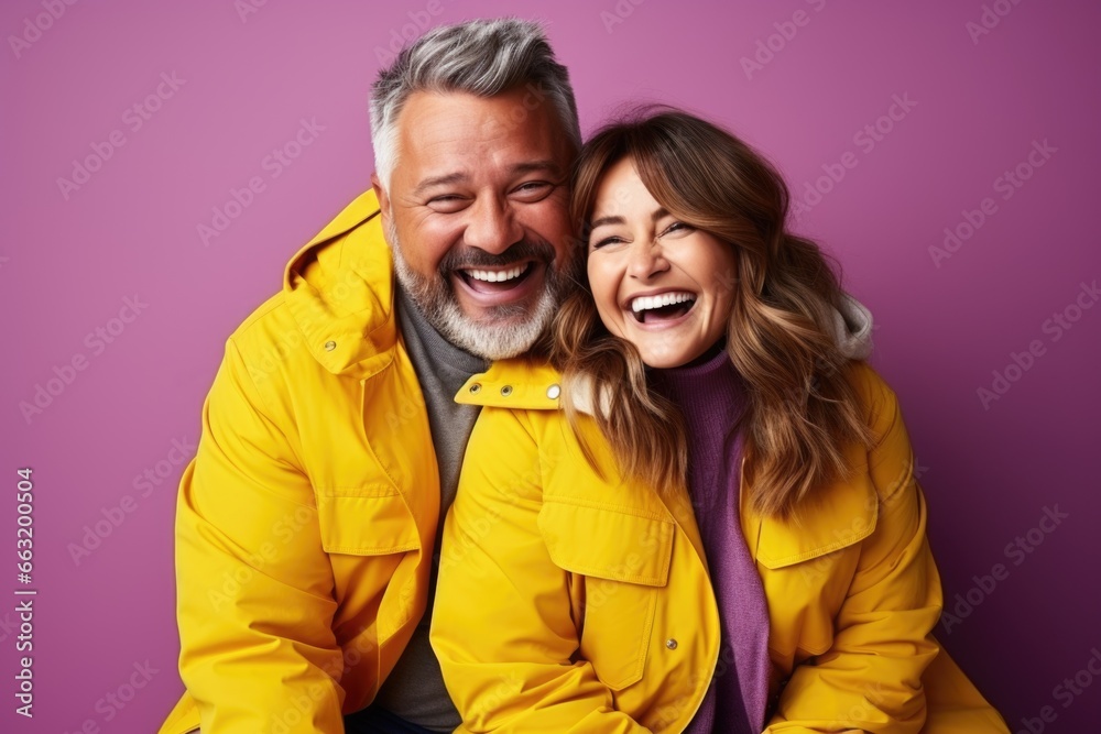 A happy pair against a well-illuminated backdrop A happy pair against a well-illuminated backdrop