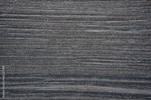 Top view of solid dark grey wooden plank, unique ornament, design and texture, material for renovation, fence, surface cover. Hardwood concept. Copy space
