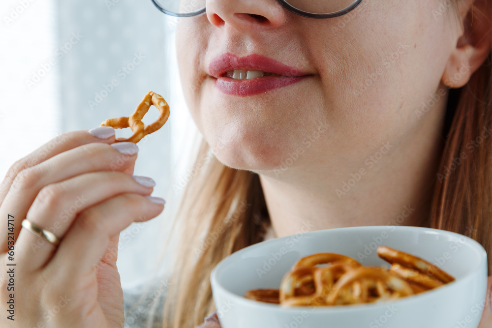 Pretty woman eating crispy crunchy cookies, addiction to carbohydrate ...