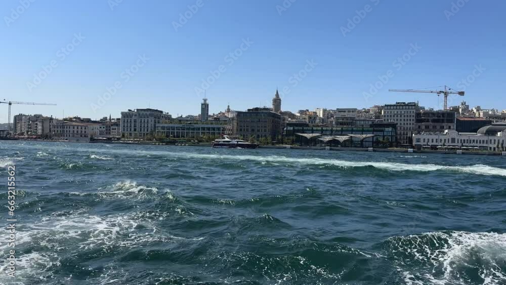 View of Istanbul turkey from back of boat driving up river View of Istanbul turkey from back of boat driving up river