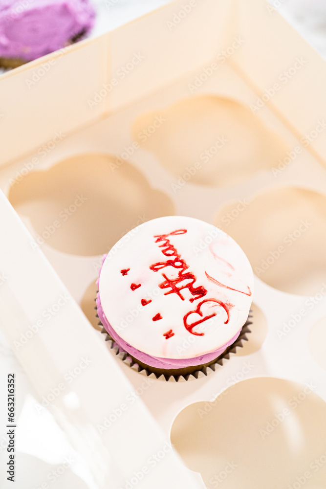 Fototapeta premium Creating Extravagant Cupcakes for Birthday Celebration