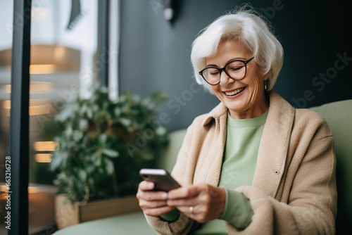An older woman uses modern technology