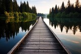 a wooden bridge path over a tranquil lake