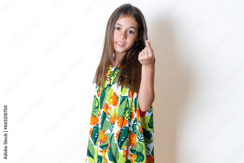 Beautiful kid girl wearing floral dress pointing up with hand showing up seven fingers gesture in Chinese sign language QÄ«. Beautiful kid girl wearing floral dress pointing up with hand showing up seven fingers gesture in Chinese sign language QÄ«.
