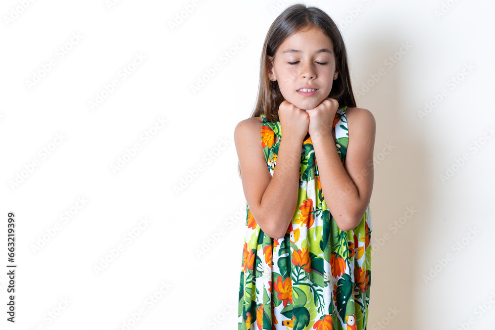 Serious MODEL crosses hands and points at different sides hesitates between two items. Hard decision concept Serious MODEL crosses hands and points at different sides hesitates between two items. Hard decision concept