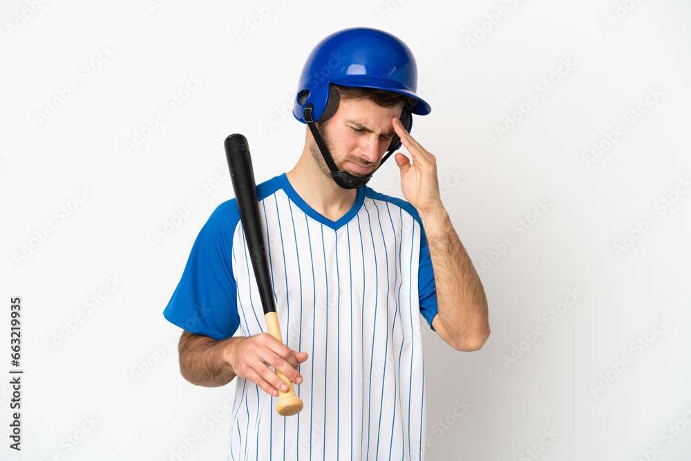 Young caucasian man playing baseball isolated on white background with headache Young caucasian man playing baseball isolated on white background with headache